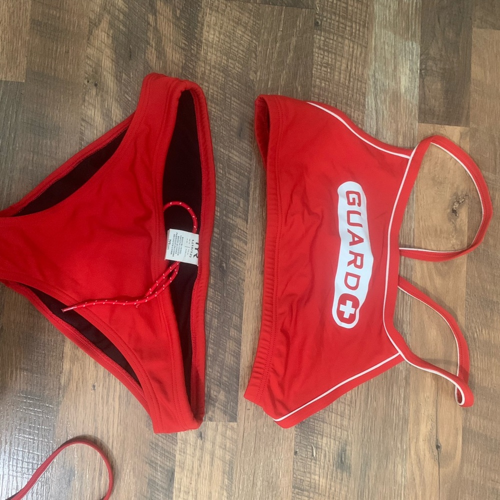 Set of lifeguarding suits two one pieces and 1 two piece